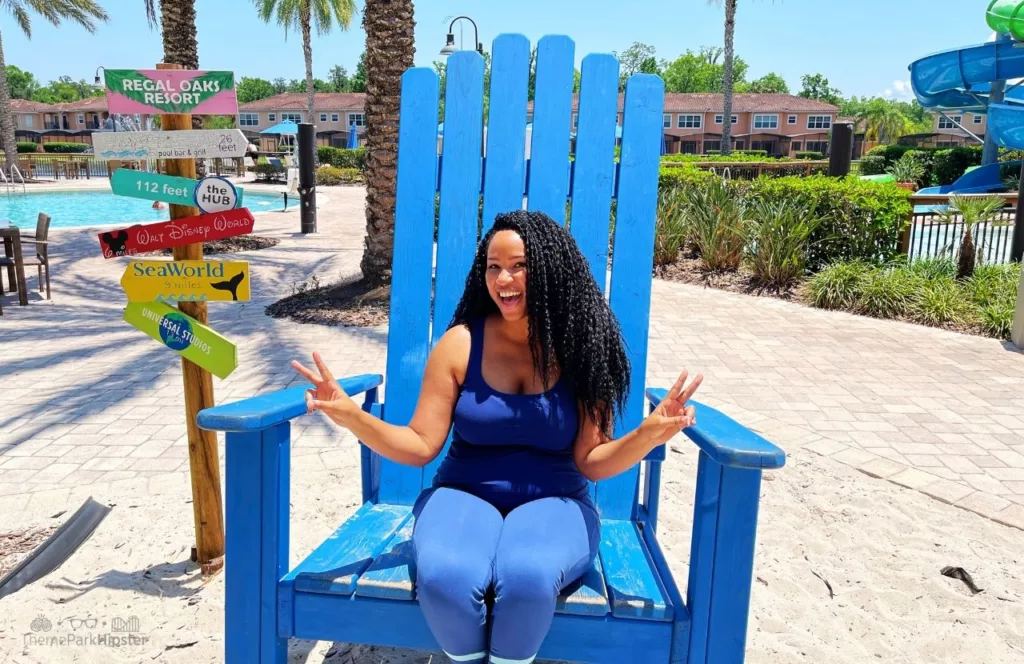 Regal Oaks Resort Near Disney World Vacation Home Pool Area with NikkyJ in Big Blue Chair