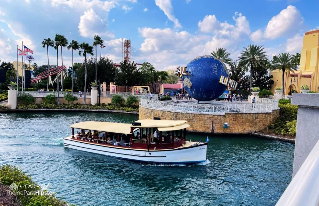 Universal Orlando Resort Boat and Globe in front of Universal Studios Arches and Hollywood Rip Ride Rockit. Keep reading to get the best Universal Studios Orlando tips for beginners and first timers.