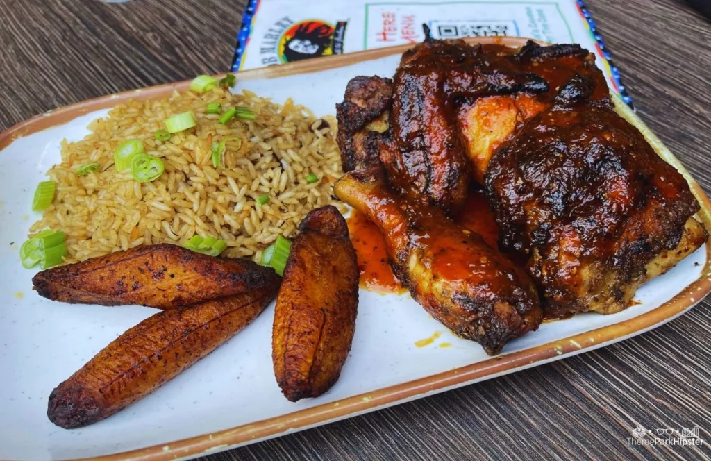 Universal Orlando Resort Bob Marley a Tribute to Freedom Restaurant in CityWalk Jamaican Jerk Chicken with rice and plantains. Keep reading to get the full Guide to Universal CityWalk Orlando with photos, restaurants, parking and more!