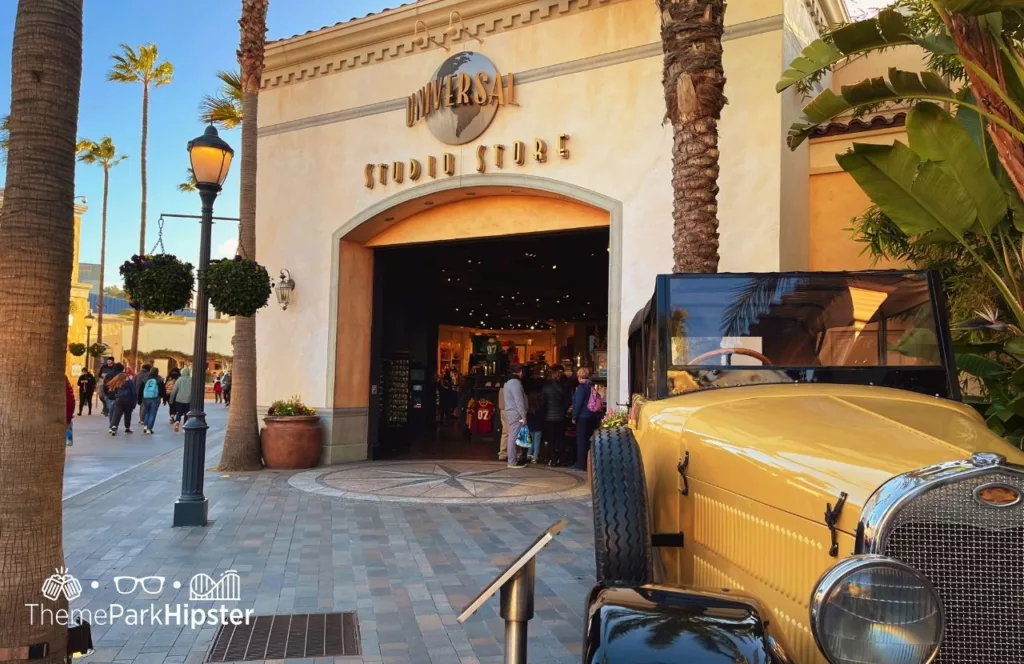 Universal Studios Hollywood Studio Store with retro yellow car in front. Keep reading to find out more of the best Universal Studios Hollywood attractions for solo travelers.