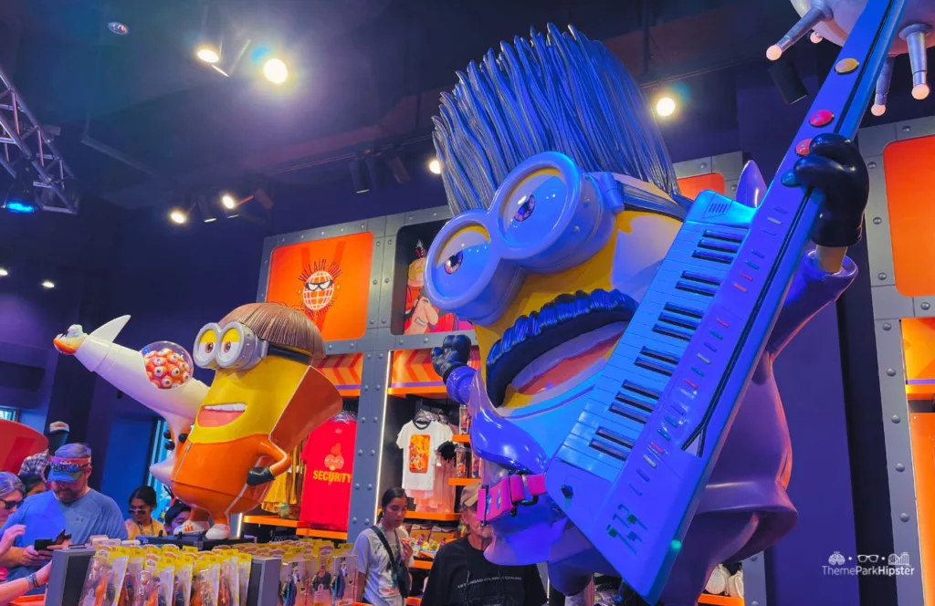 Universal Studios Orlando Florida Minion Land Villain Con Store and Merchandise with two bigger than life minions on display. Keep reading to see the 10 things to know before you go to Universal Orlando Resort in 2024.