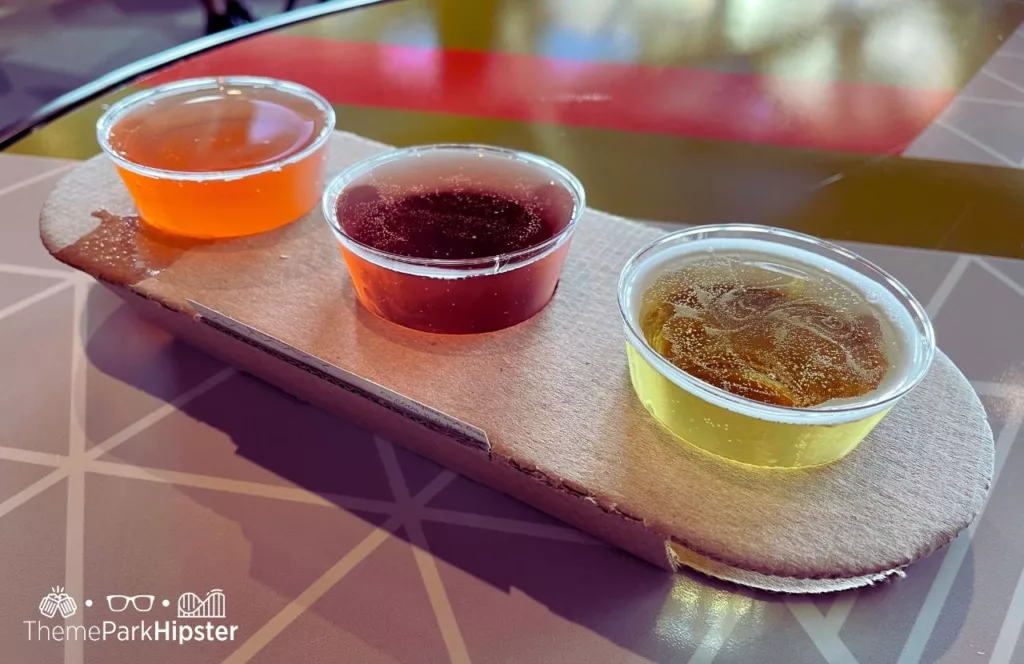 Epcot Food and Wine Festival at Disney Odyssey Cider Flight. Keep reading for the best Epcot drinking around the world passport ideas!