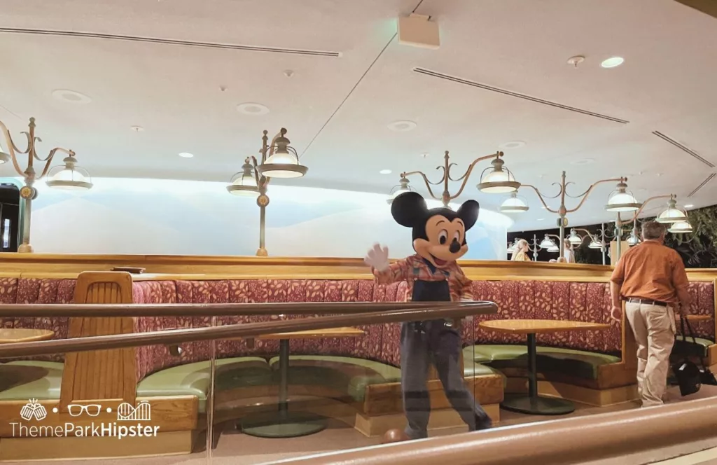 2023 Epcot Food and Wine Festival at Disney The Land Pavilion Garden Grill with Mickey Mouse Character Meet and Greet Buffett. Keep reading to find out more about Disney World characters. 