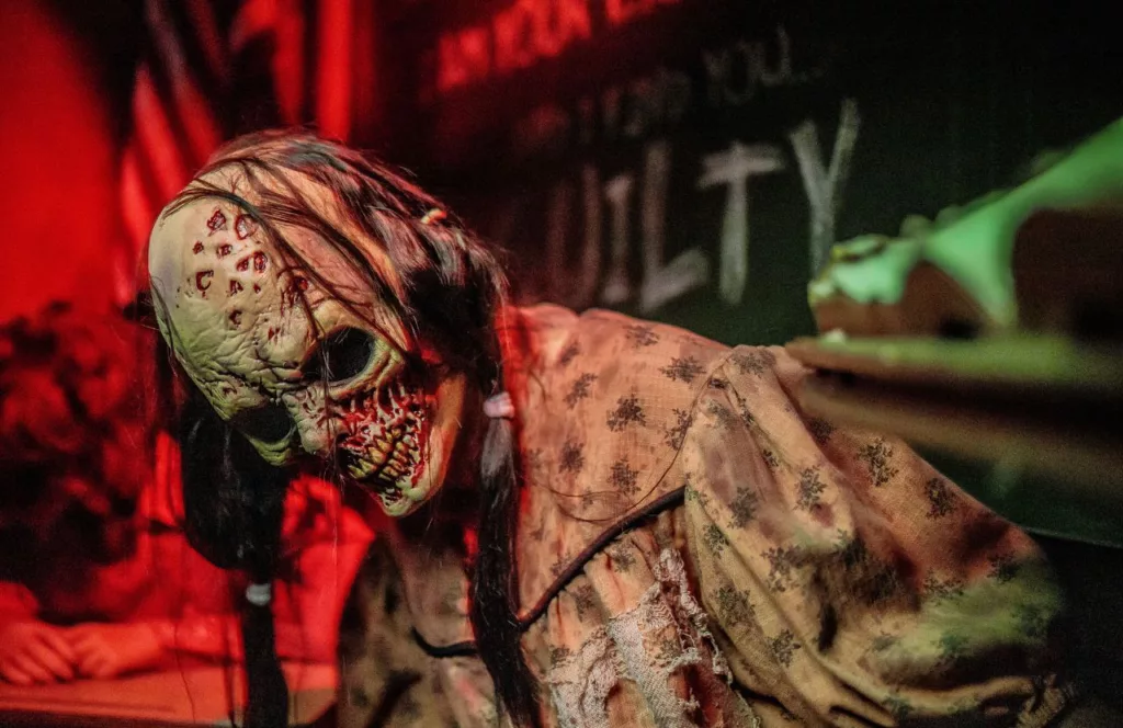 Origins The Curse of Calico Haunted House with a zombie dressed as the years of calico at the 2023 Knott's Scary Farm at Knott's Berry Farm in California. Keep reading to find out all you need to know about Knott’s Scary Farm mazes 2023.