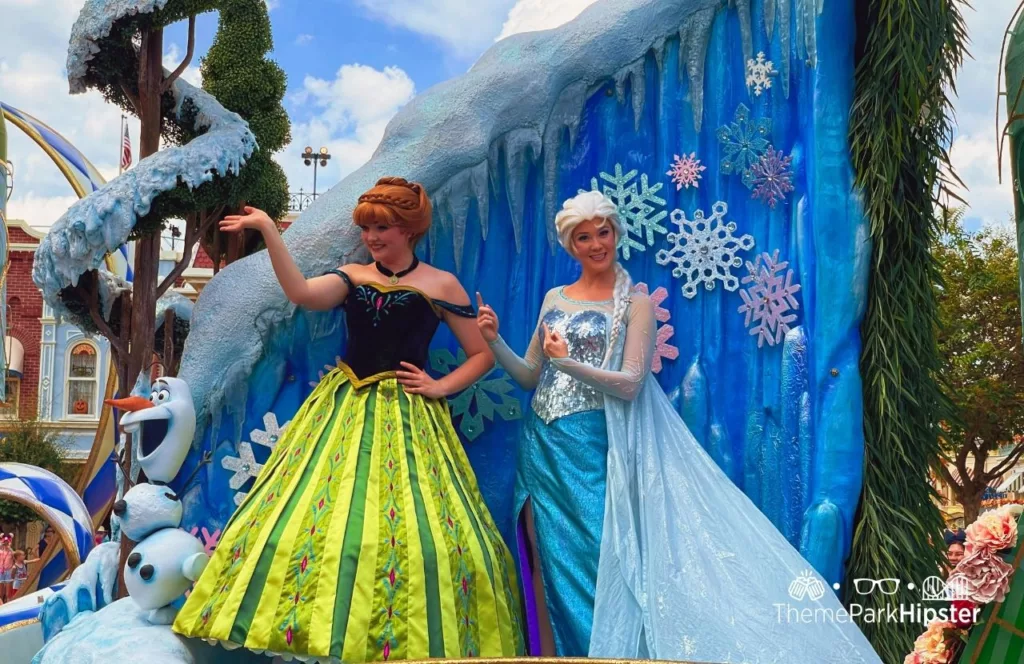 Disney Magic Kingdom Theme Park Festival of Fantasy Parade Frozen with Anna and Princess Elsa. Keep reading to learn the difference between alone vs lonely and how to have the perfect solo Disney World trip.