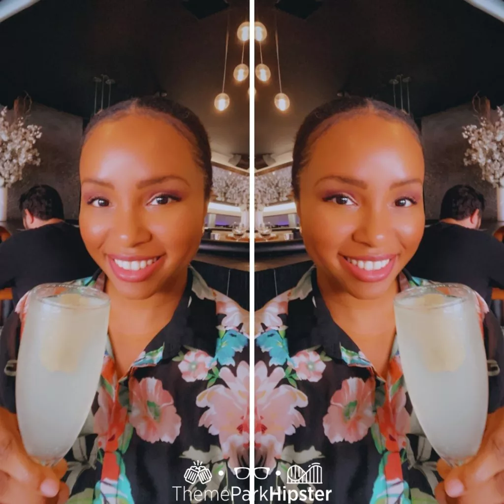 STK Orlando Disney French 75 with NikkyJ at Disney Springs. Keep reading to learn how to go to a theme park alone.