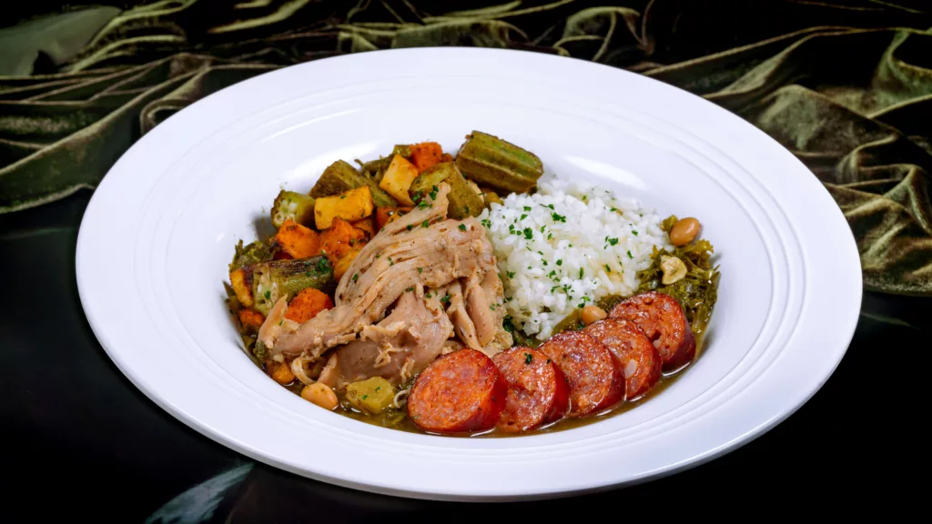 Tiana’s Palace Menu Item – 7 Greens Gumbo with Chicken and  Andouille Sausage