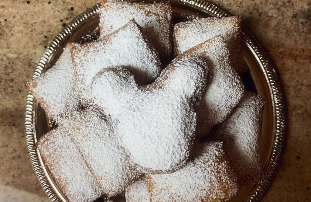 Platter of Beignets at Disney Parks. Keep reading to find out more about Disneyland food.