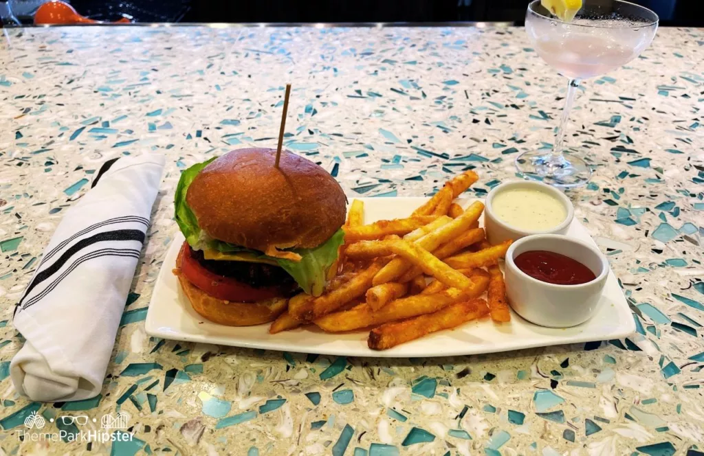 Burger and Fries at the Shark Lounge. Keep reading to find out more about Encore Resort. 