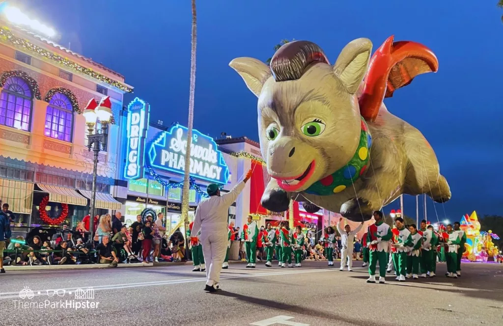 2023 Christmas at Universal Orlando Holiday Parade featuring Macy's Donkey Dragon from Shrek