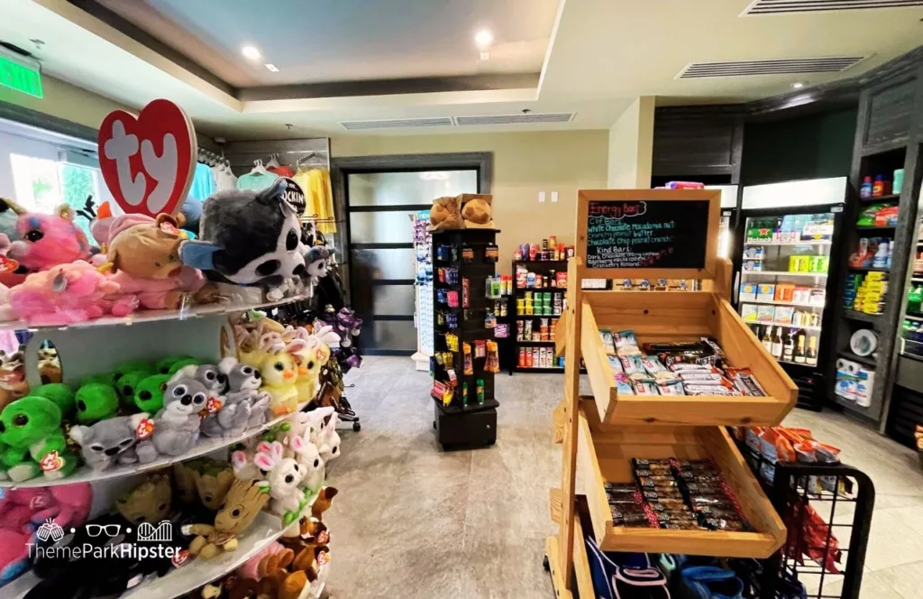 Gift shop and grab and go market at Encore Resort with food, drinks, plush toys and merchandise. Keep reading to learn more about Encore Resort Orlando.