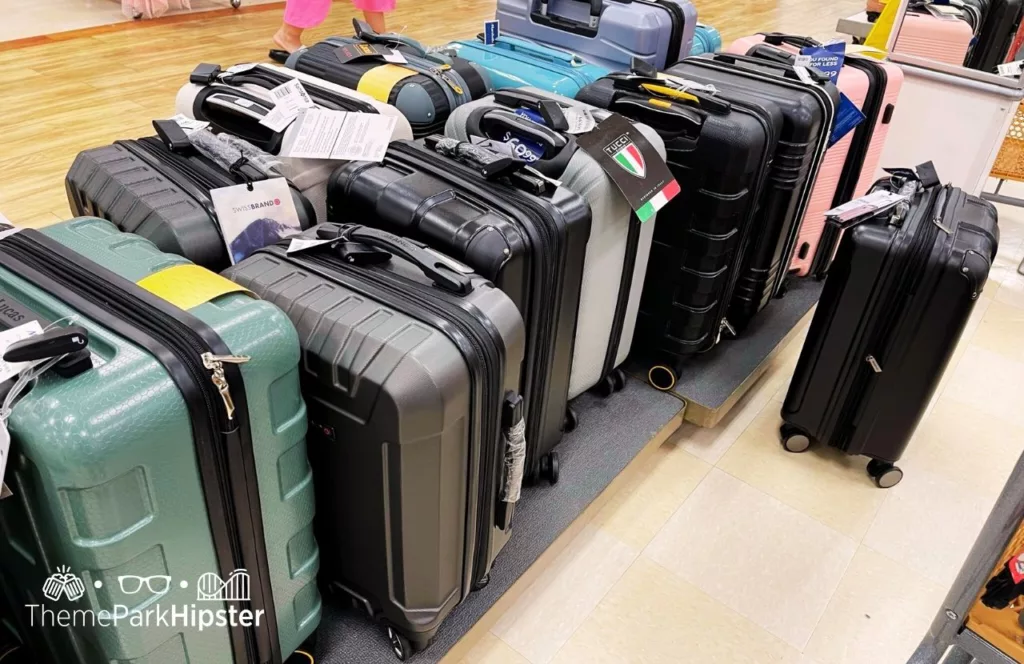 Various suitcase and luggage for Disney World with lots of different colors and styles.  Keep reading to learn how to choose the best luggage for Disney World.
