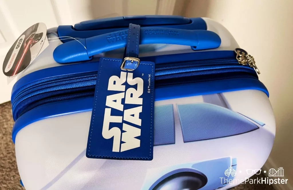 Top view and Star Wars label of R2D2 Star Wars Suitcase. Keep reading to find out more about packing for Disney.