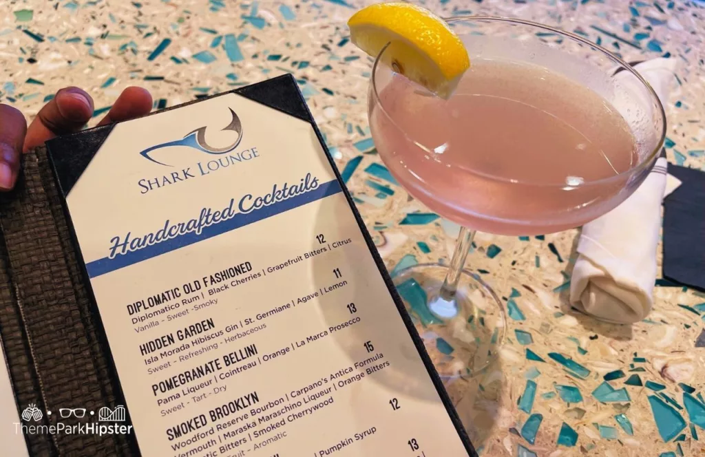 Menu with Martini at the on site restaurant at Shark Lounge. Keep reading find out all you need to know about Encore Resort.