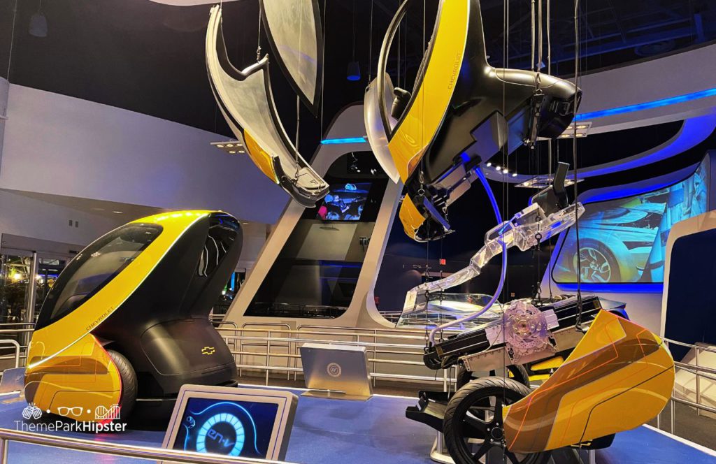 History of Test Track Ride at Epcot car assembly line in queue. One of the best epcot rides ranked from worst to best for your disney world vacation.