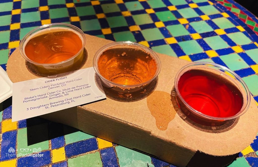 2024 Epcot Festival of the Arts Disney World Cider Flight in Morocco Pavilion. Keep reading to get the full Epcot Festival of the Arts Menu!