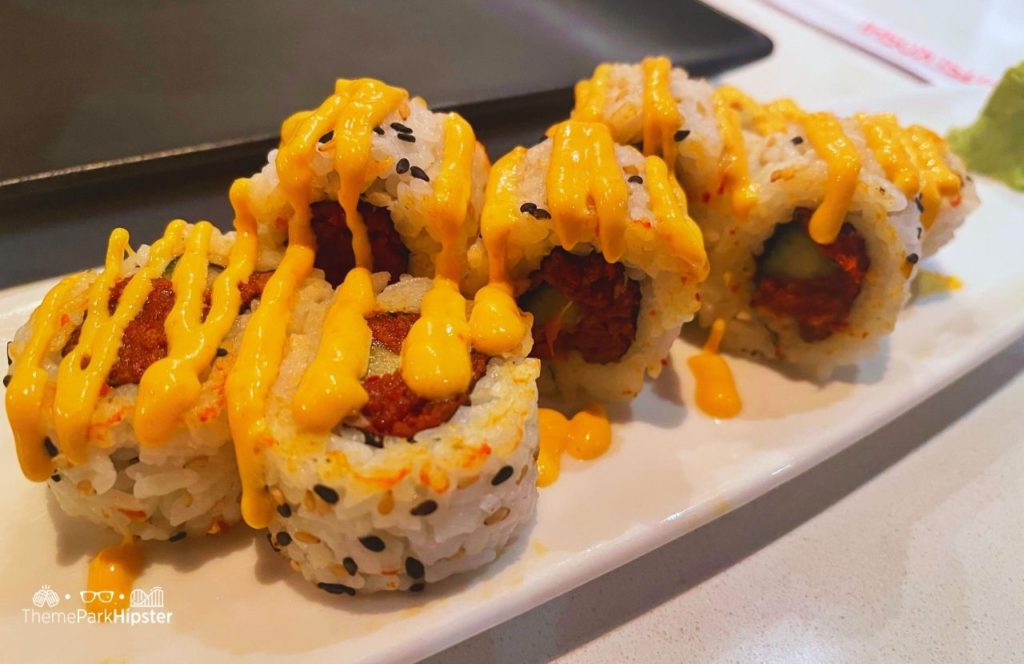 2024 Epcot Festival of the Arts Disney World Teppan Edo Hibachi in Japan Pavilion Spicy Tuna Sushi Roll. Making it one of the best restaurants at Disney World for adults!