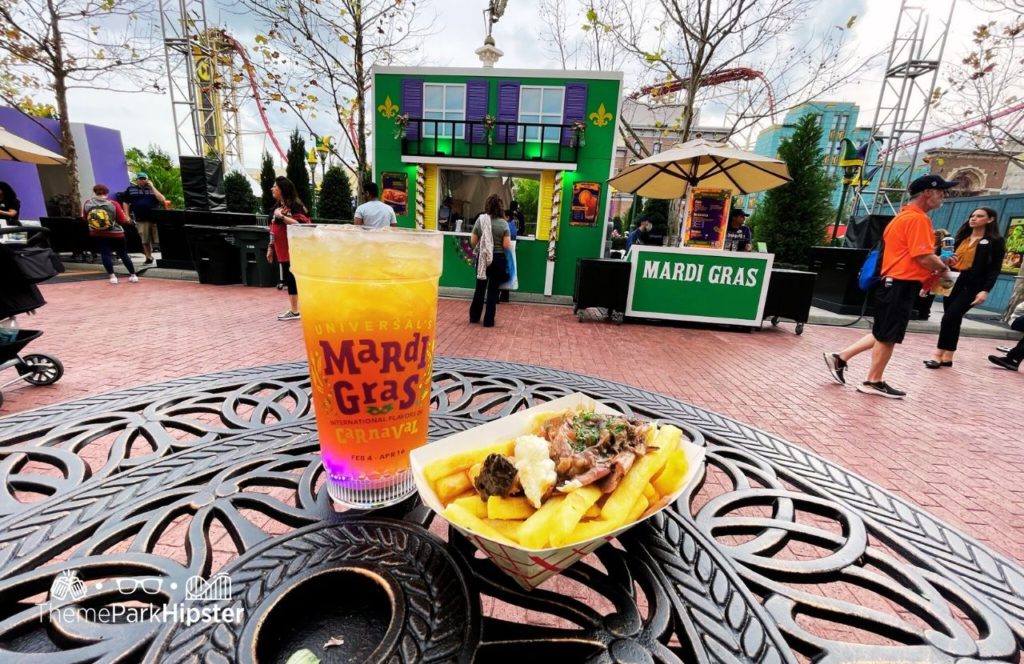 2024 Mardi Gras at Universal Studios Florida Maple Smash and Short Rib Beef Poutine at Canada Food Booth. One of the best things to eat at Universal Mardi Gras.