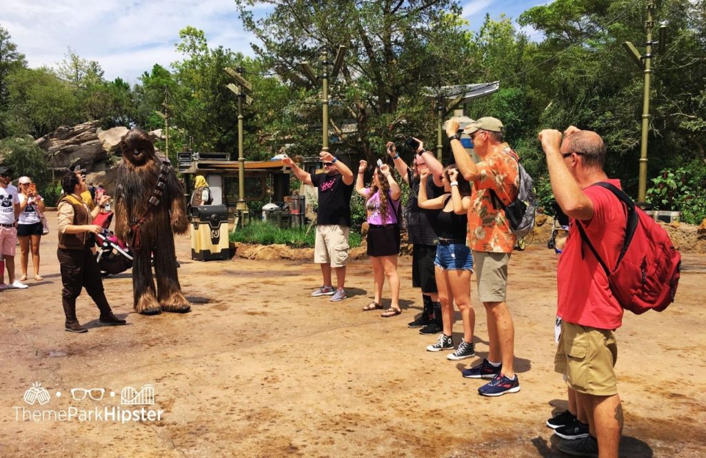 Disney Hollywood Studios Star Wars Galaxy's Edge with Chewbacca. Keep reading to see why you must go to Hollywood Studios alone on your solo Disney trip.