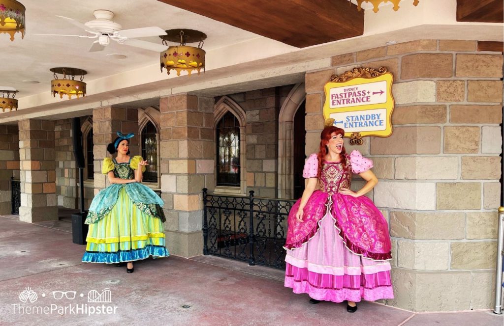 Disney Magic Kingdom Park Cinderella Evil Step Sisters Character Meet and Greet in Fantasyland. Keep reading to discover more about Disney PhotoPass and Memory Maker.