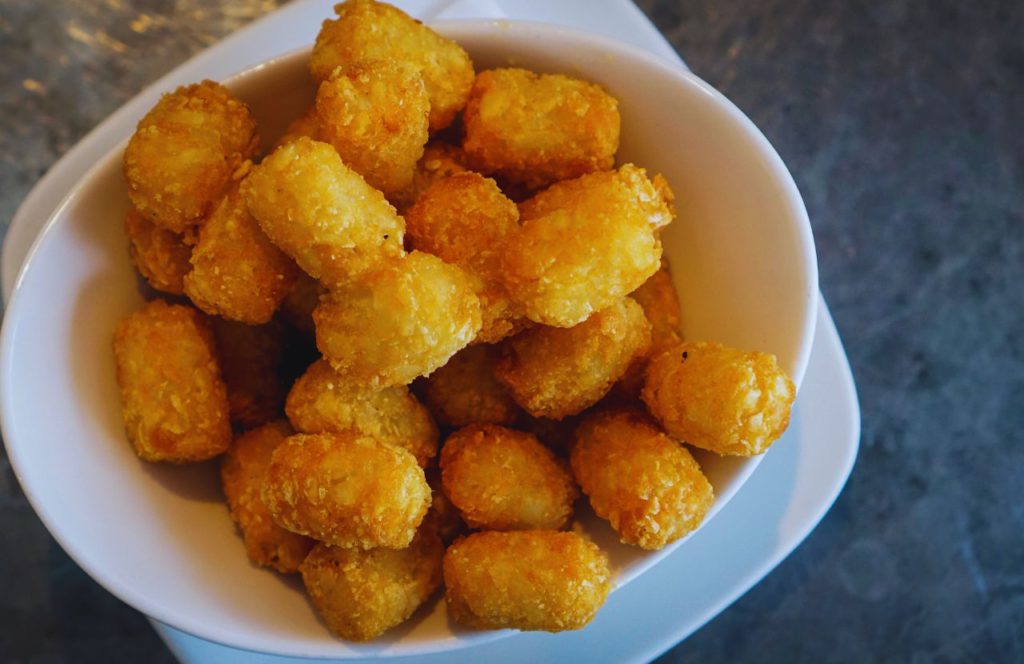 Tater Tots in a white bowl at Disney's Friar's Nook in Magic Kingdom