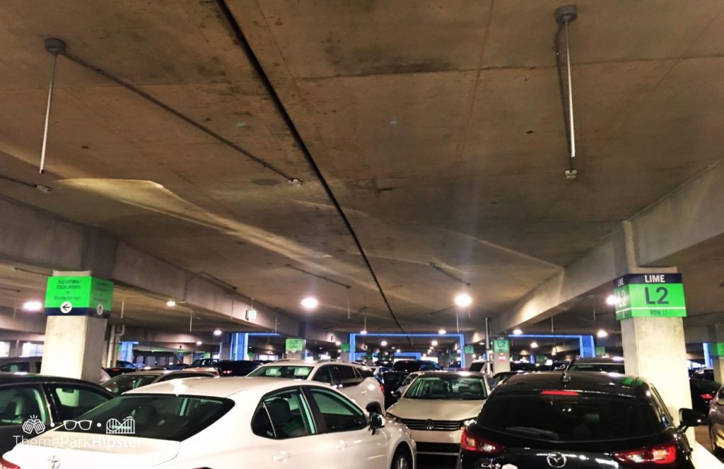 Walt Disney World Disney Springs Parking Lime Garage. Keep reading to find out more about how much it costs to park at Disney World.