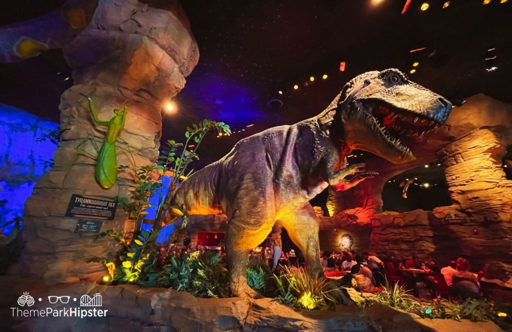 Walt Disney World Disney Springs T-Rex Cafe Restaurant Tyrannosaurus Dinosaur. Keep reading to discover more about how much it costs to park at Disney World.
