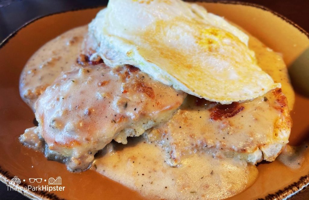 Walt Disney World Disney Springs Wine Bar George Restaurant Sausage Biscuit and Gravy with Egg. One of the best places to get breakfast at Disney World.