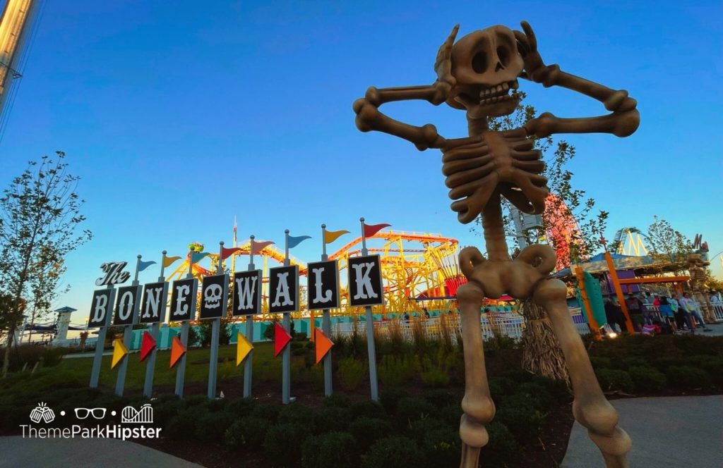 Cedar Point Ohio Amusement Park The Bone Walk Boardwalk with Wild Mouse Roller Coaster at Halloweekends Skull decor. One of the best things to do at Cedar Point.